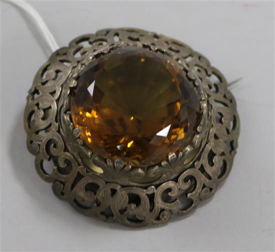 A large Victorian Scottish pierced silver mounted citrine brooch, 6.5cm.